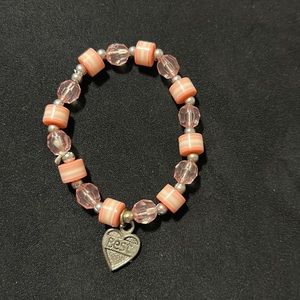 Kids stretchy plastic purple and pink beaded bracelet. Gently used.